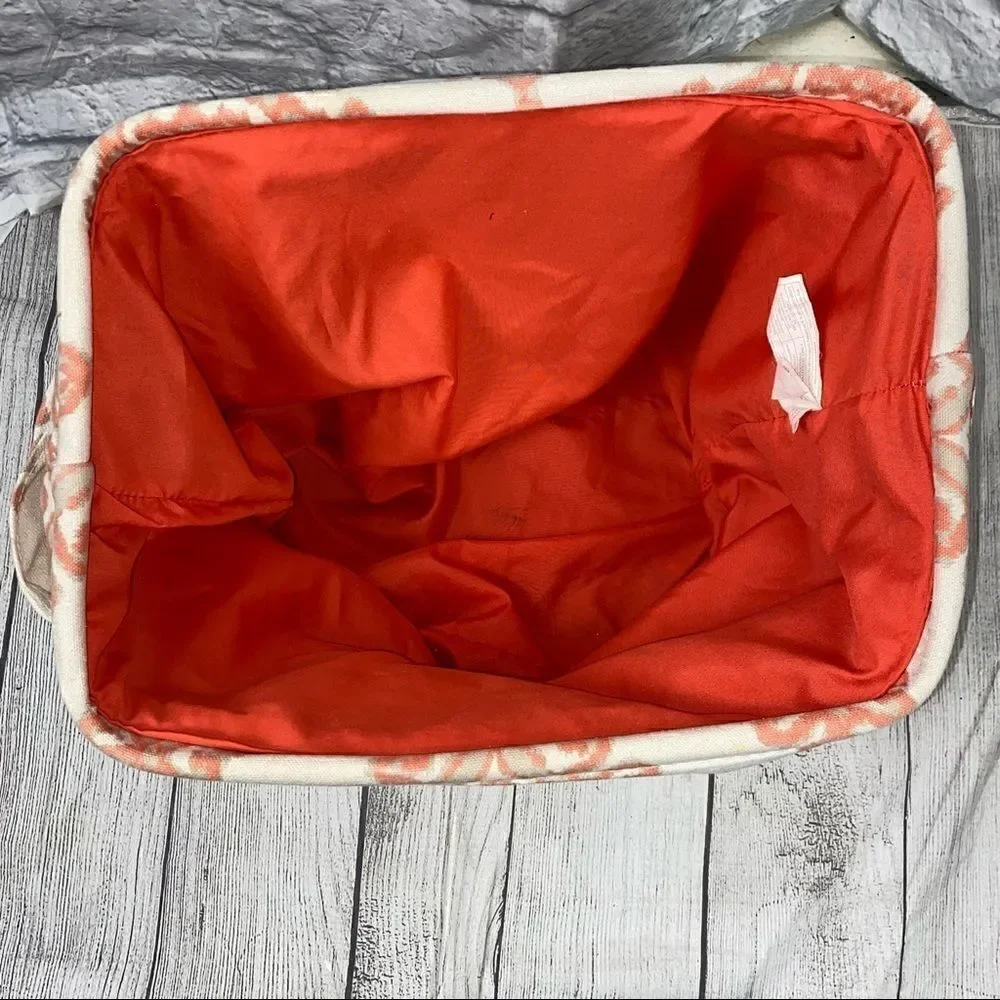 Collapsible print canvas covered storage cube with metal rim and side handles